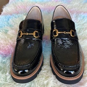 Pair of Sofft black patent loafers, Size 10, lug soles, gold buckle